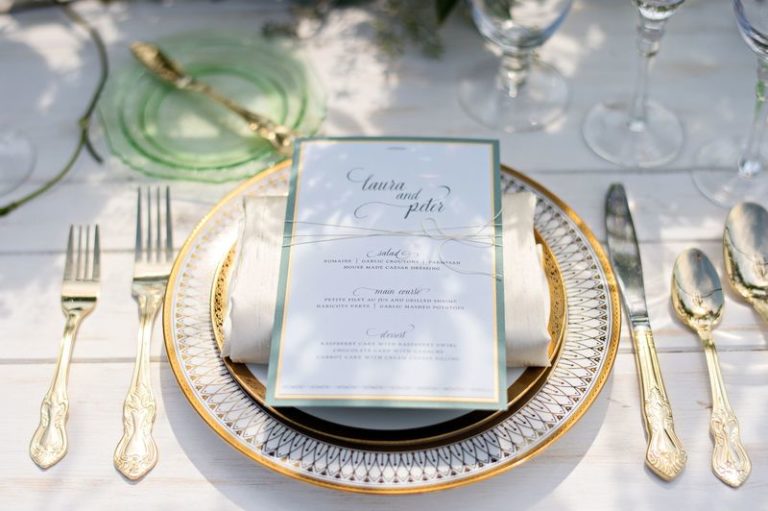 elegant seaside inspired shoot gold charger and gold flatware
