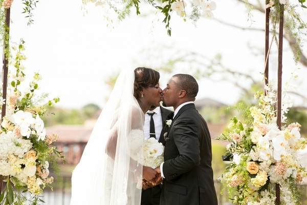 bride and groom first kiss