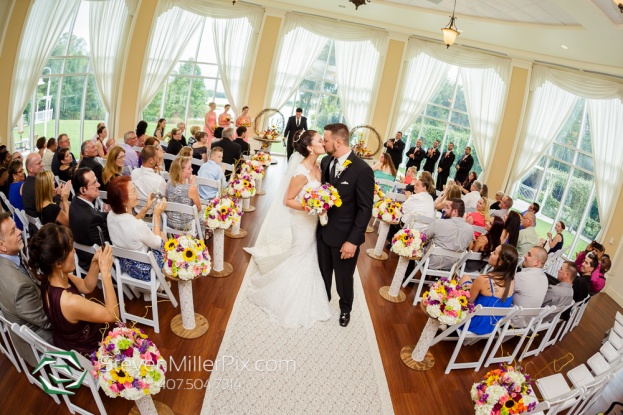 rustic wedding bride and groom first kiss