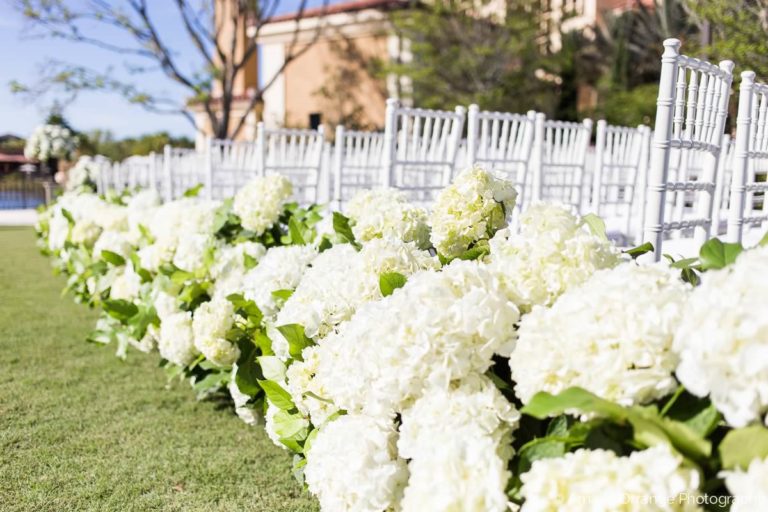 champagne and gold wedding white chiavari chairs and floral