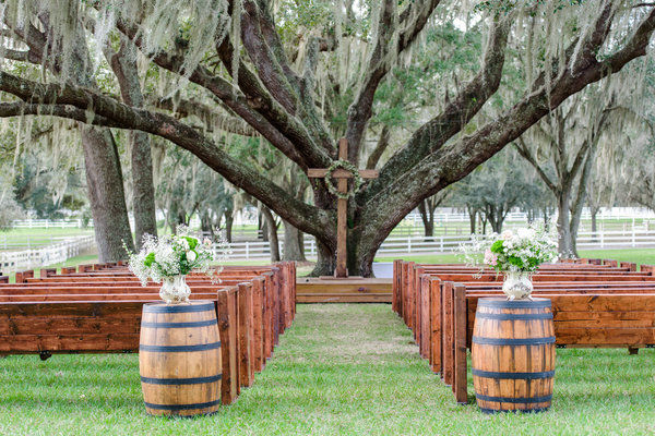 lange farm wedding church pews, whiskey barrels