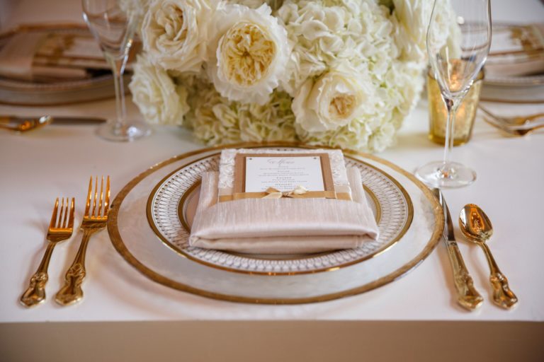 modern elegance styled shoot gold flatware - gold rimmed chargers 2