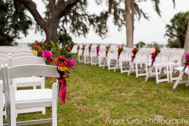 vibrant spring wedding white folding chairs