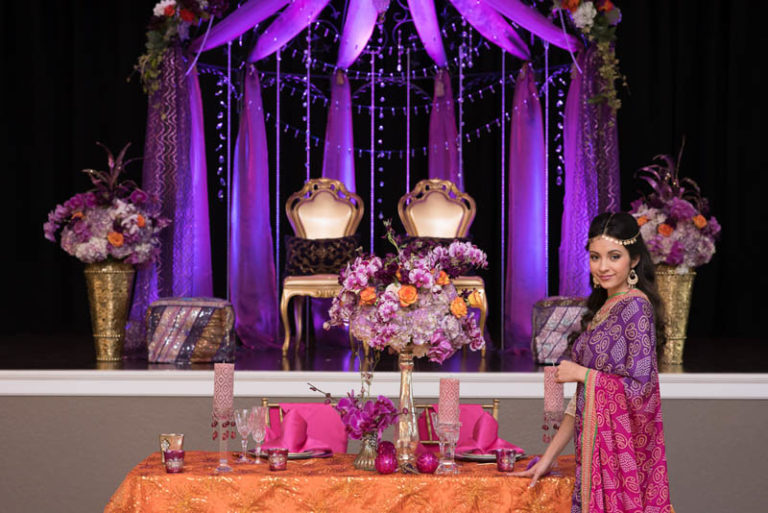 purple and gold indian themed styled shoot gold specialty chairs floral