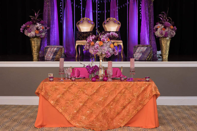 purple and gold indian themed styled shoot gold specialty chairs reception decor