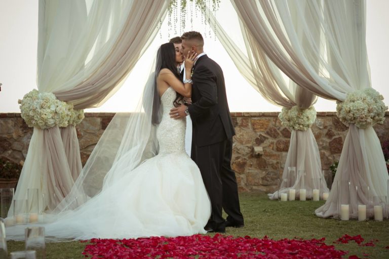 ivory and gold bella collina wedding, first kiss