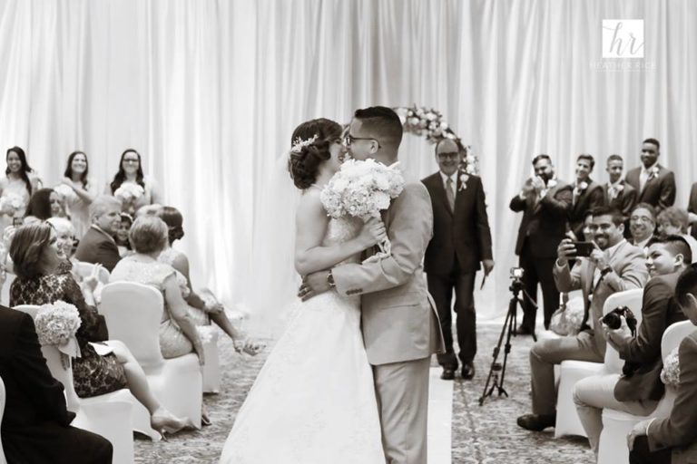 MIssion Inn Resort Wedding ceremony kiss