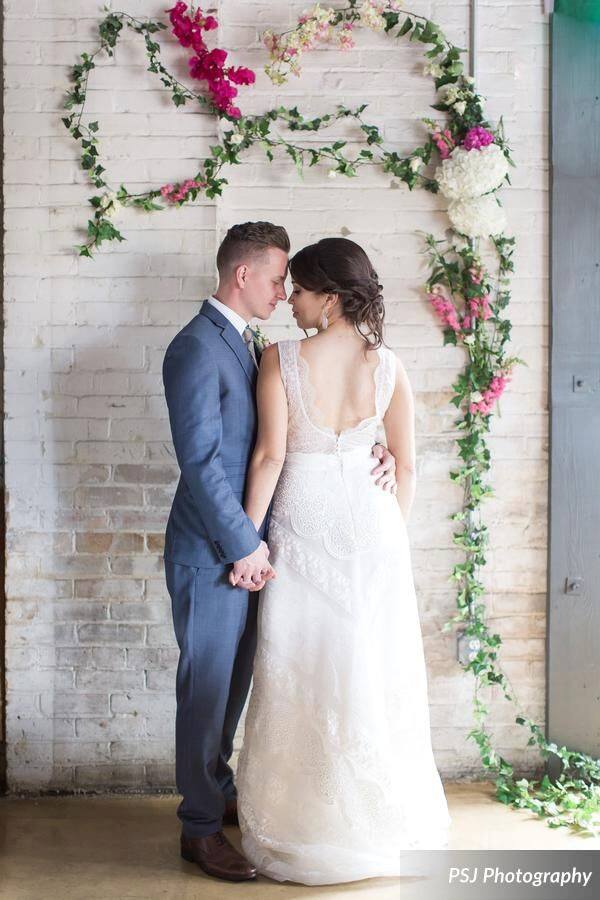 Downtown Deland Wedding Shoot A Chair Affair floral wall