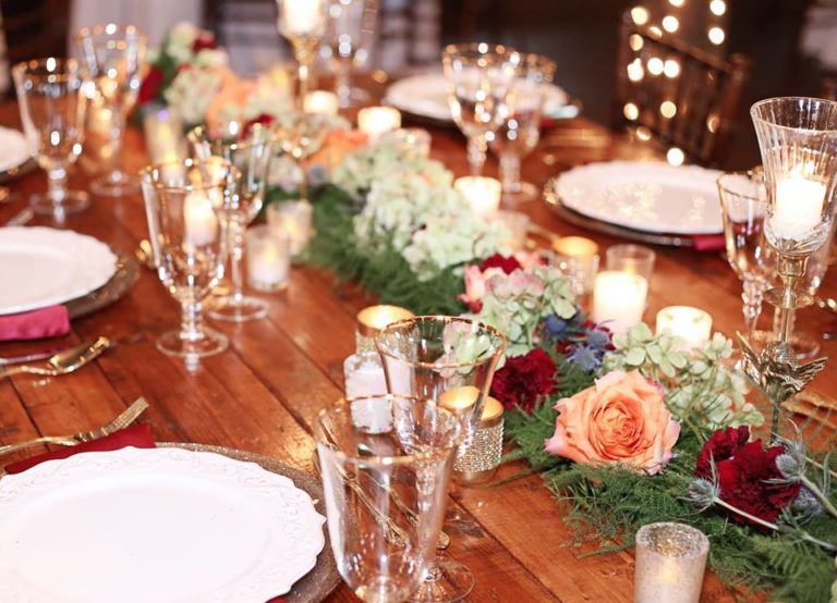 Enchanting Barn Wedding Inspiration A Chair Affair gold flateware gold stemware champagne charger 1