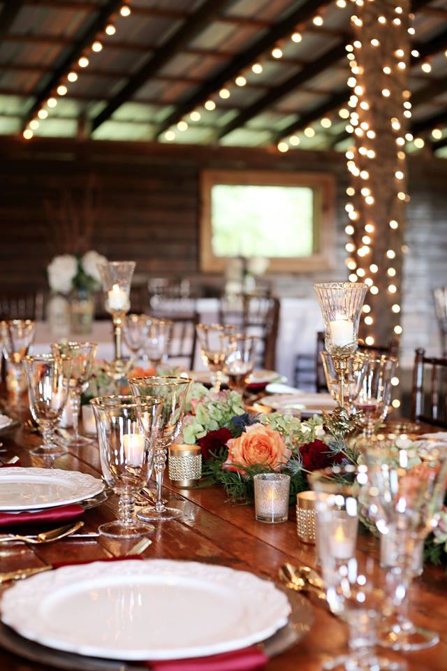 Enchanting Barn Wedding Inspiration A Chair Affair gold flateware gold stemware champagne charger 3