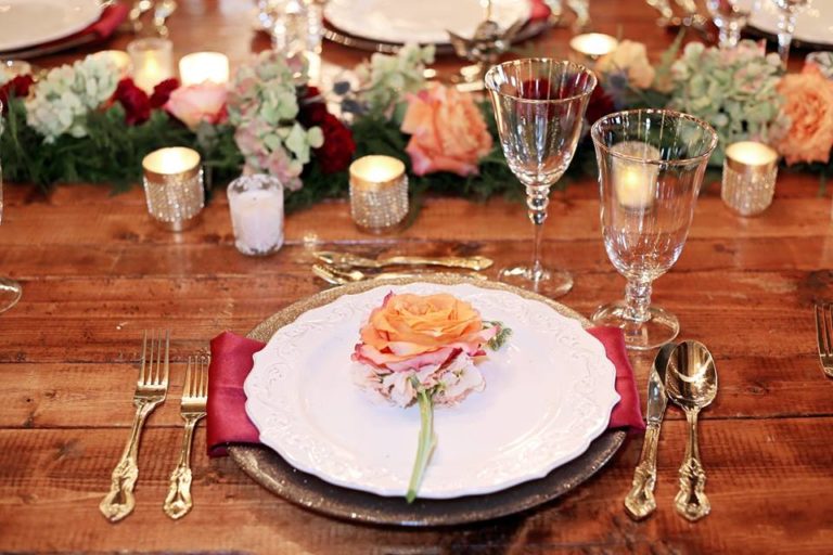 Enchanting Barn Wedding Inspiration A Chair Affair gold flatware gold stemware champagne charger