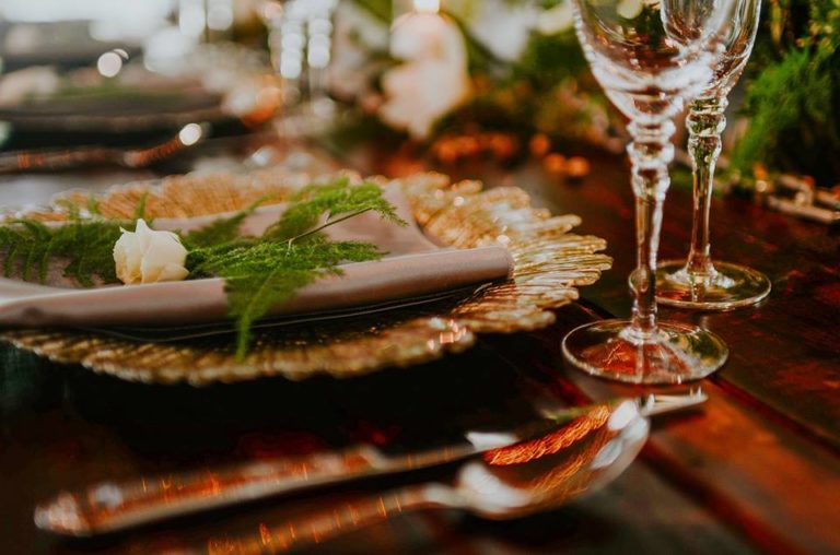 industrial wedding inspiration a chair affair gold seaburst charger gold stemware farm table 1