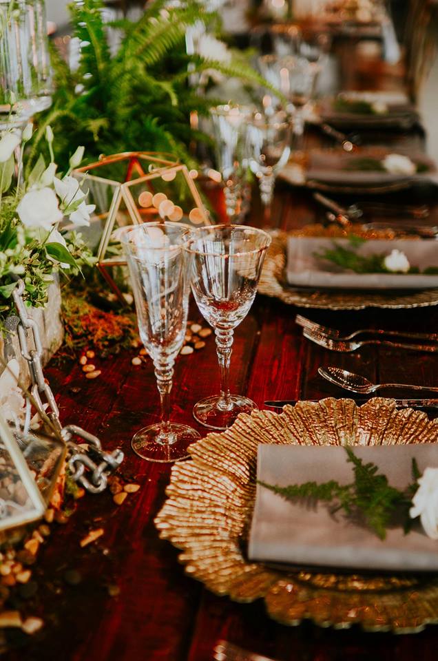 industrial wedding inspiration a chair affair gold seaburst charger gold stemware farm table 2