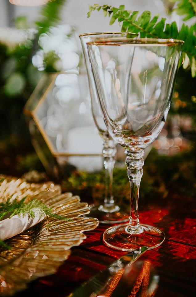 industrial wedding inspiration a chair affair gold seaburst charger gold stemware farm table