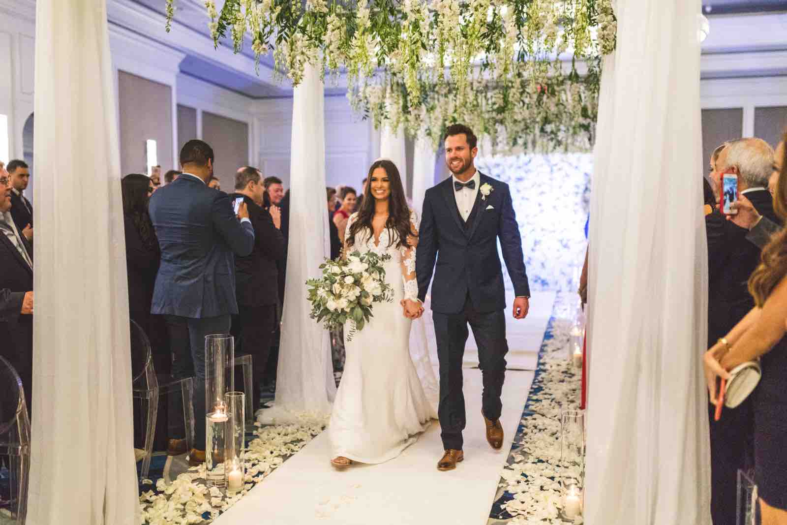 Ivory and Gold Wedding at the Ritz Carlton Sarasota wedding a chair affair Aisle