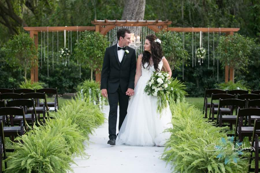 Once Upon a Time at Bakers Ranch wedding A Chair Affair Couple with Black Folding Chairs