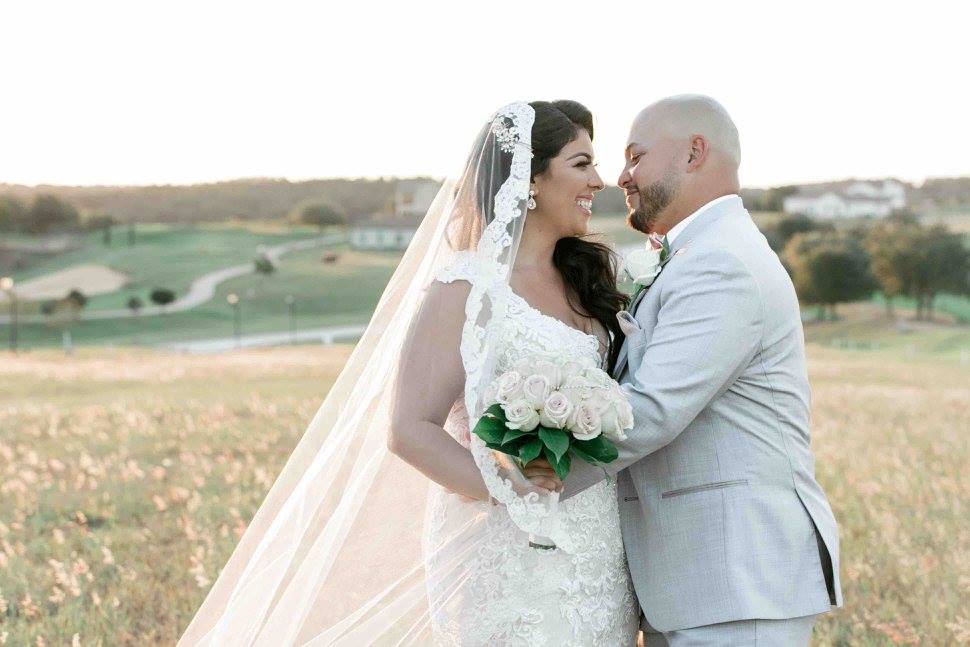 Ivory and gold Bella Collina wedding A Chair Affair newlyweds