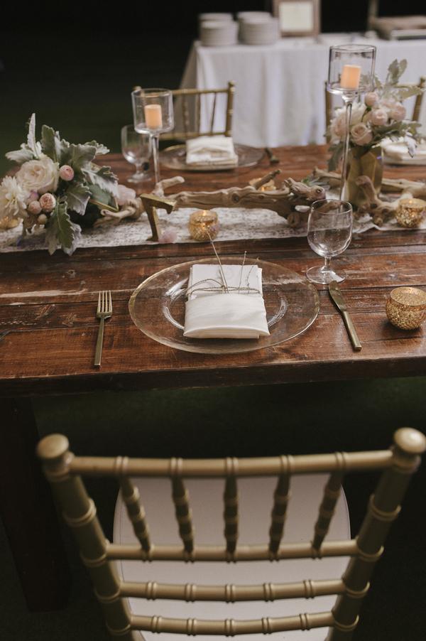 boho chic beach wedding A Chair Affair gold Chiavari chair gold flatware and gold rim charger