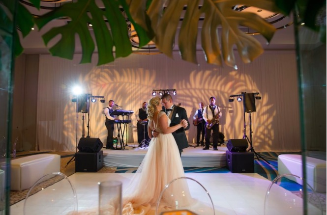 Modern Gold Ballroom Wedding Shoot A Chair Affair Couple with Ghost Chairs Dance