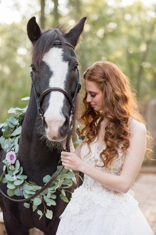 Vendor Spotlight The Flower Studio Enchanted Forest Shoot Captured by Belinda model posing with horse wedding florist