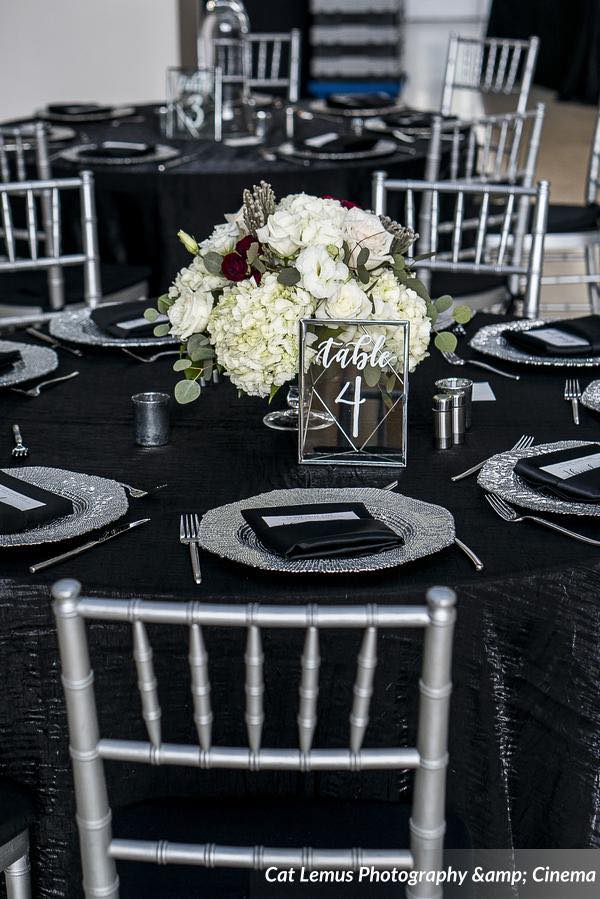 modern winter wedding A Chair Affair silver chiavari chairs and silver octo charger table