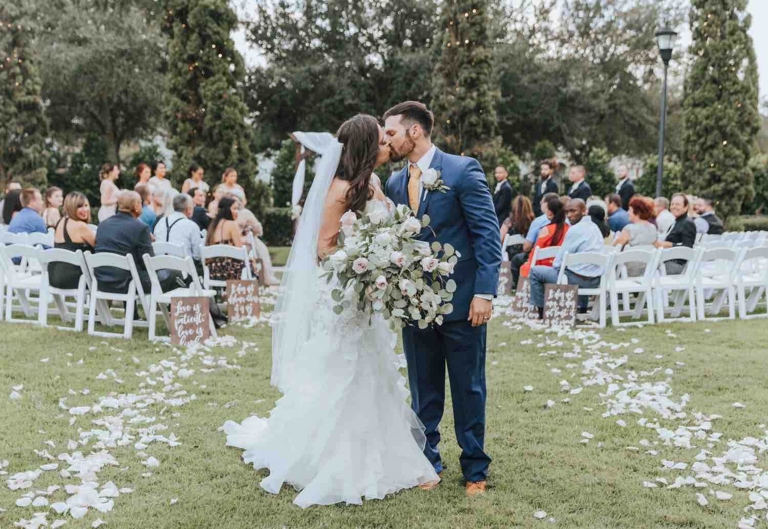 romantic ranch wedding a chair affair white folding chairs ceremony kiss