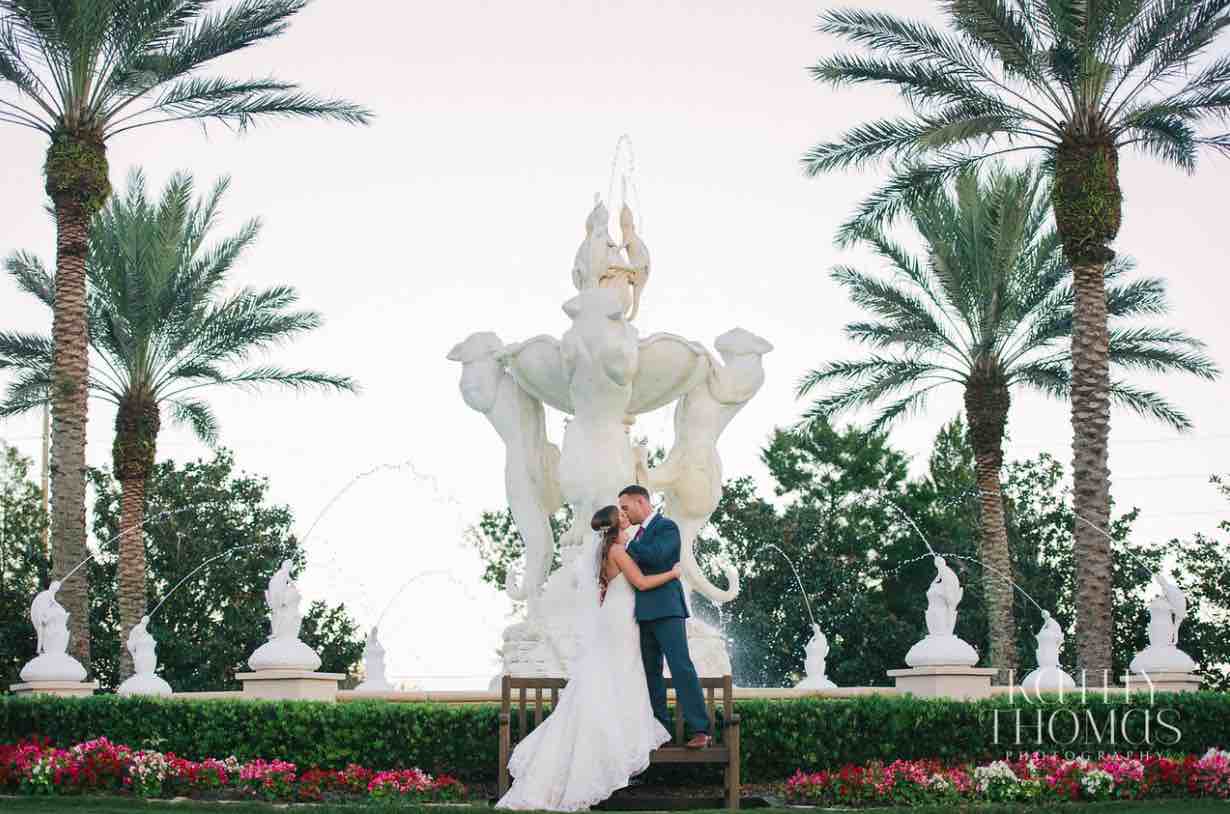 Alexa and Derek luxury Ritz Carlton wedding A Chair Affair couple posing