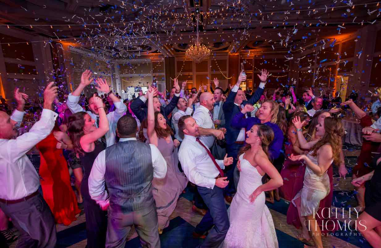 Alexa and Derek luxury Ritz Carlton wedding A Chair Affair dancing with confetti