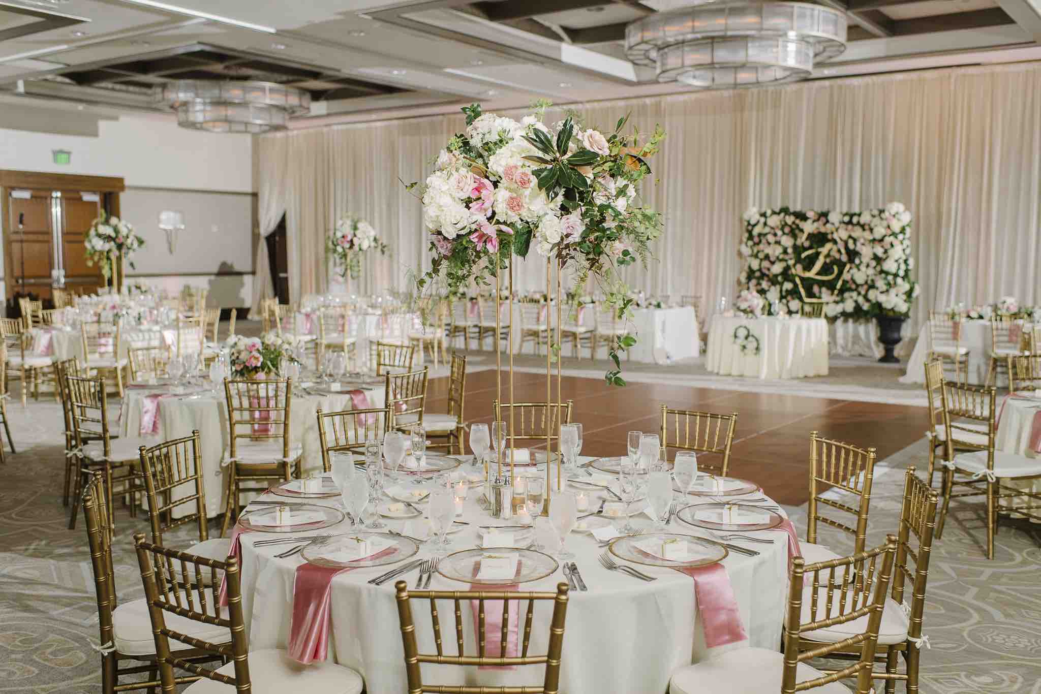 Alfond Inn wedding Winter Park A Chair Affair table with gold rim chargers and brushed gold flatware Sunglow Photography