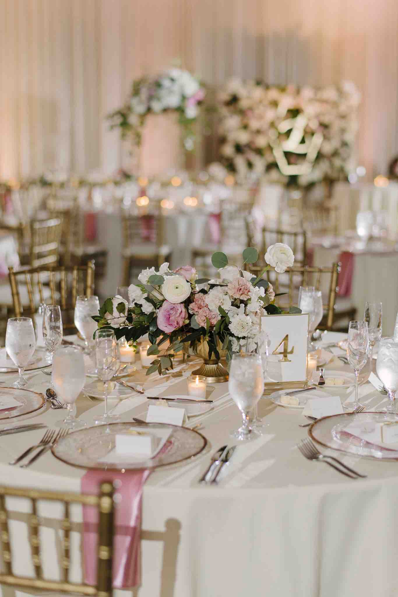 Alfond Inn wedding Winter Park A Chair Affair table with gold rim chargers with brushed gold flatware Sunglow Photography