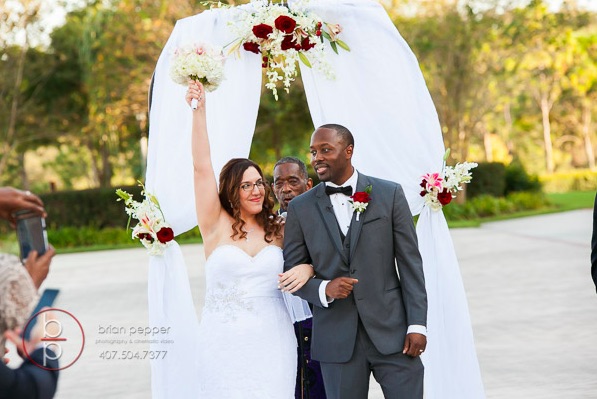 Rosen Shingle Creek Resort Wedding with Ivory and Berry Mary and Brandon Ceremony A Chair Affair garden wedding arch