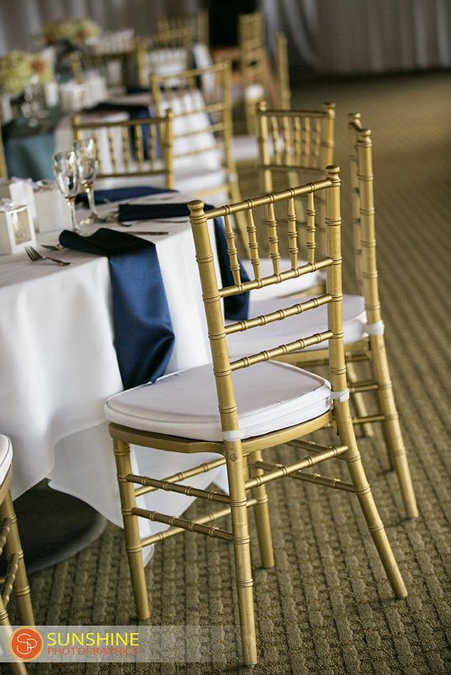 Suzanne and Jason gold and navy wedding Mission Inn Resort A Chair Affair gold Chiavari chairs with white pad reception