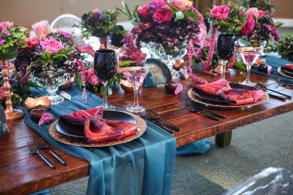 Isla del Sol Wedding Shoot-A Chair Affair-farm table-rose gold charger-black china-black goblets-black flatware