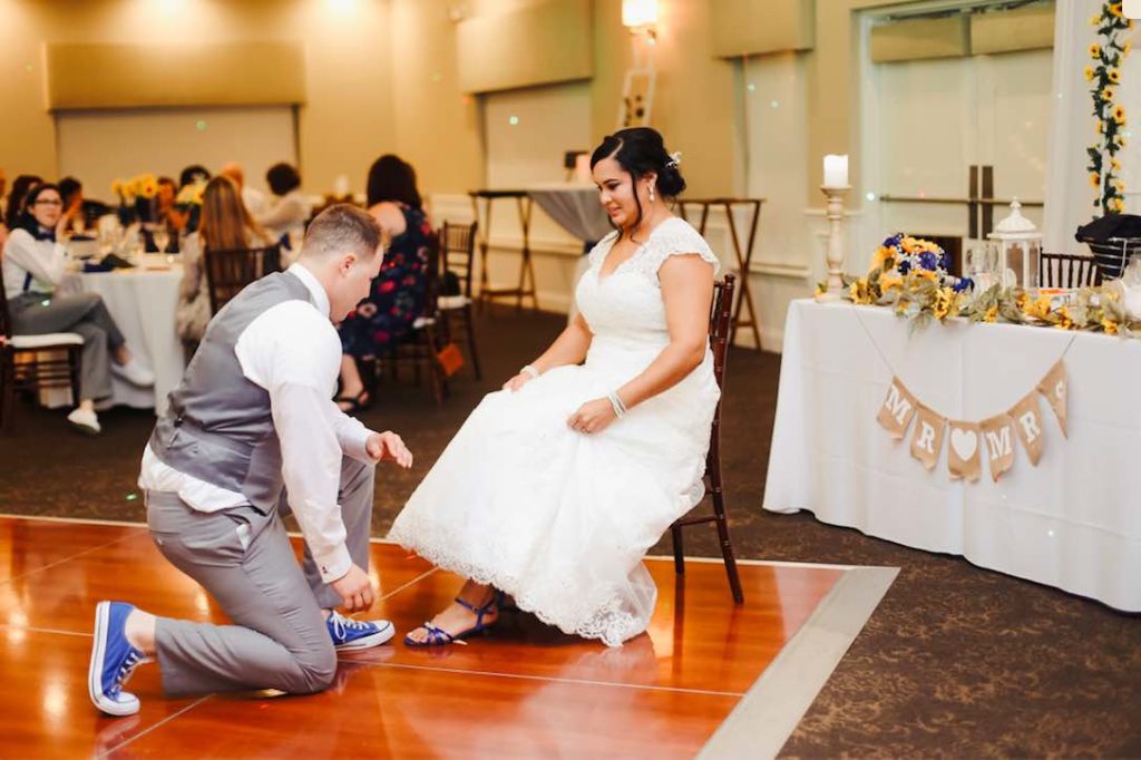 Royal Blue Wedding in Central Florida Garter Toss with A Chair Affair Mahogany Chiavari Chairs with White Pads It Takes 2 Photography