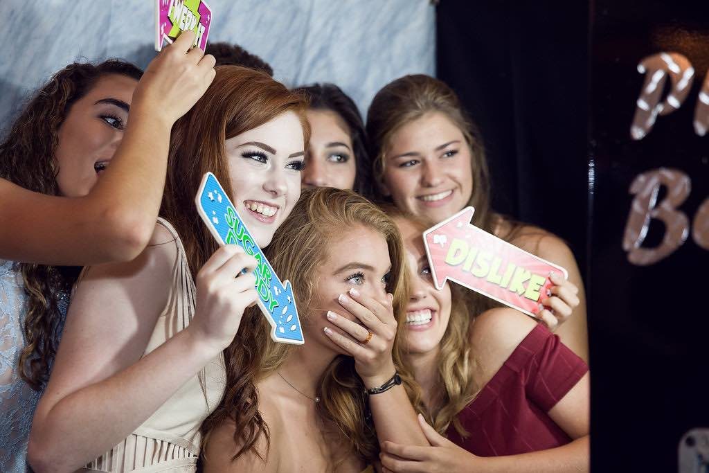 Traditional Birthday Celebration Four Seasons Orlando Quinceanera Girls at Photobooth Our Photobooth Rocks A Chair Affair Marta Boschmann Photography