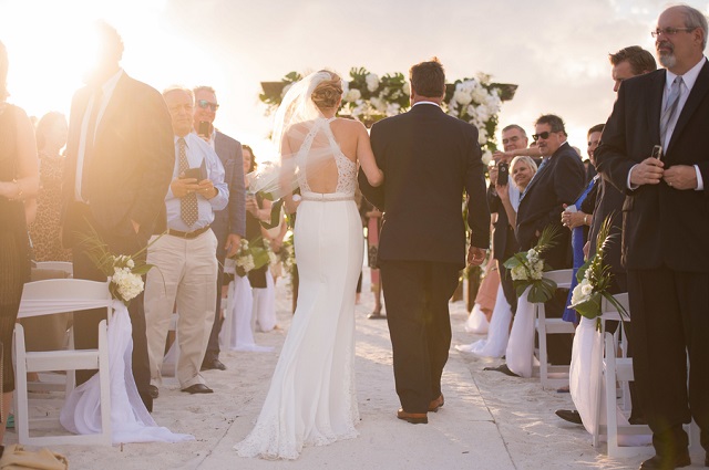 Carlouel Yacht Club Old Florida Wedding-Beach Ceremony Processional-White Folding Chairs-A Chair Affair