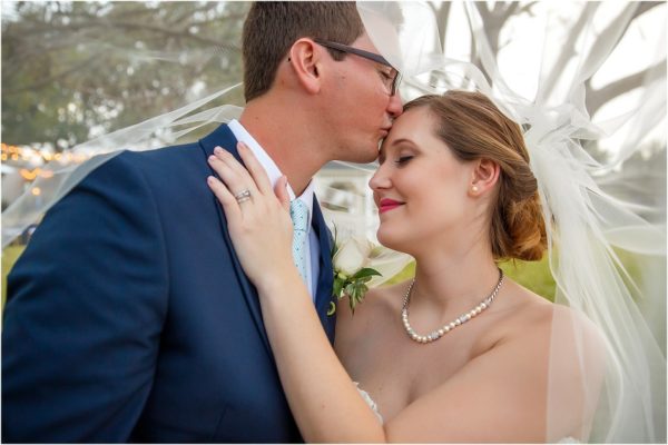 Davis Island Garden Club Outdoor Wedding-Bride and Groom Kiss- A Chair Affair