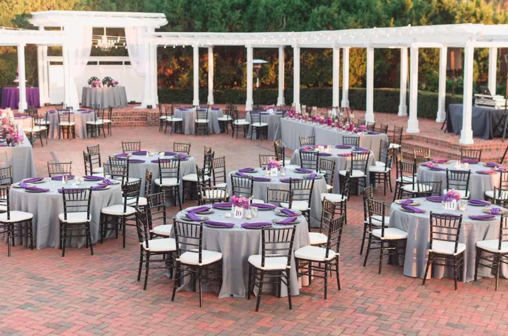 Rafael and Matt winter Cypress Grove Estate Wedding LGBT Wedding A Chair Affair black Chiavari chairs with ivory pads and black deco chargers Captured by Elle