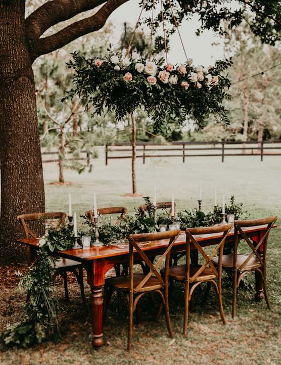 country chic wedding A Chair Affair French Country Chairs with greenery and candles