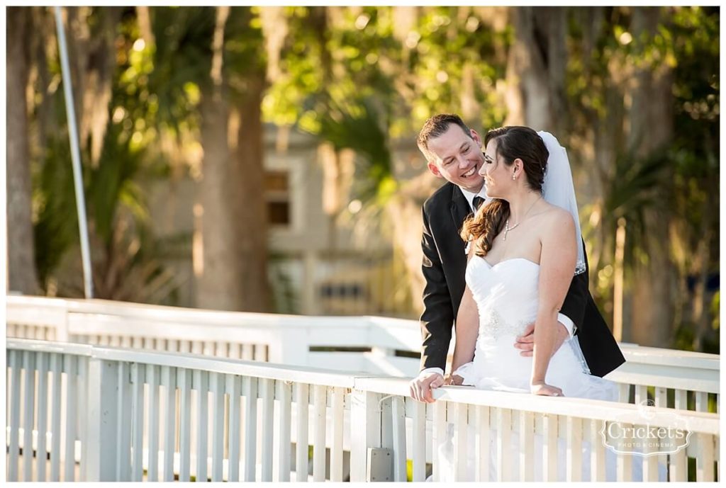 paradise-cove-orlando-wedding a chair affair bride and groom bridge