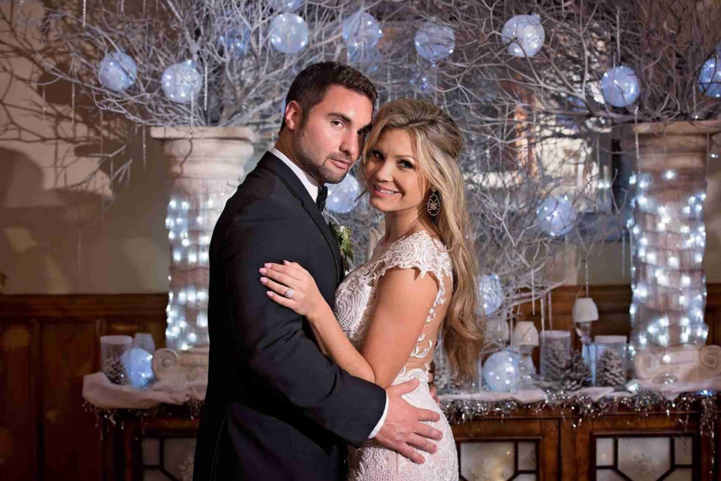 stetson mansion a chair affair bride and groom posing