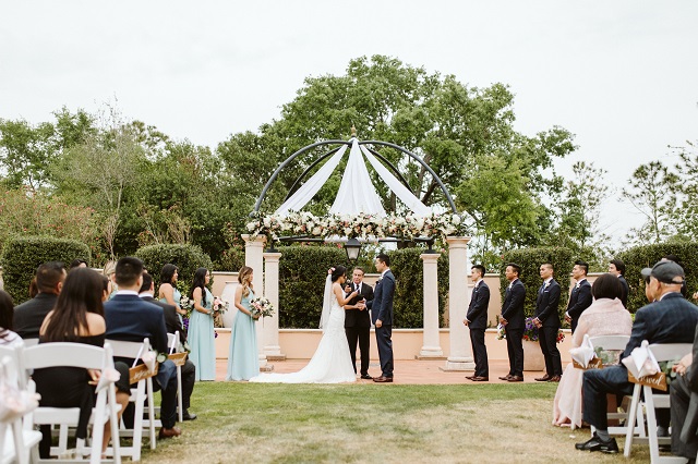 Portofino-Bay-Wedding-Outdoor-Ceremony-White-Folding-Chairs-A-Chair-Affair.jpg