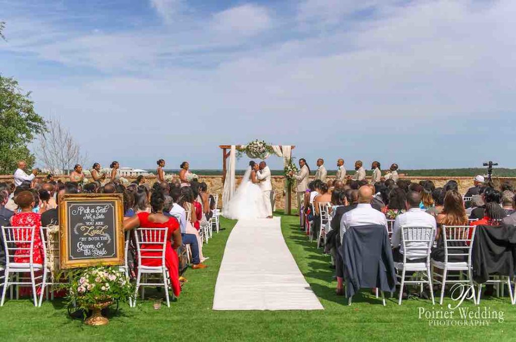 Valisha and Philip Pastel and Gold Bella Collina Wedding A Chair Affair White Chiavari Chairs at ceremony with guests and couple