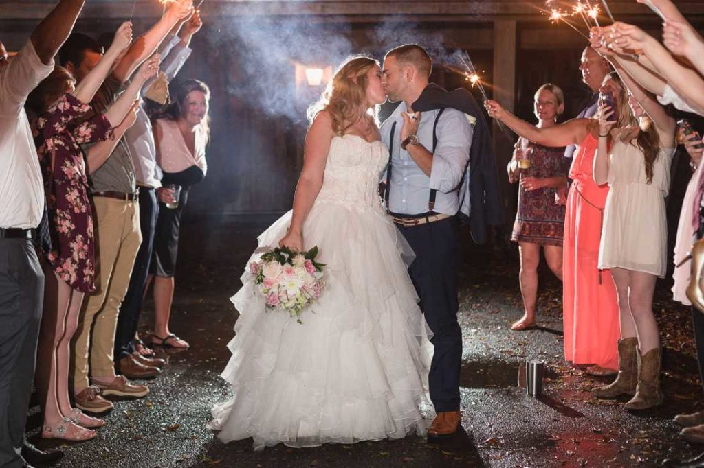 hammock house a chair affair bride and groom kiss exit