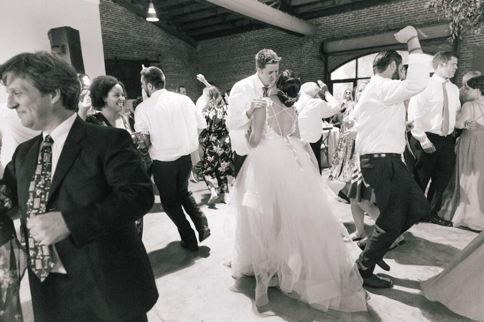 morean center a chair affair bride and groom kiss bw