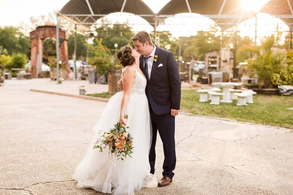 morean center a chair affair bride and groom kiss outside