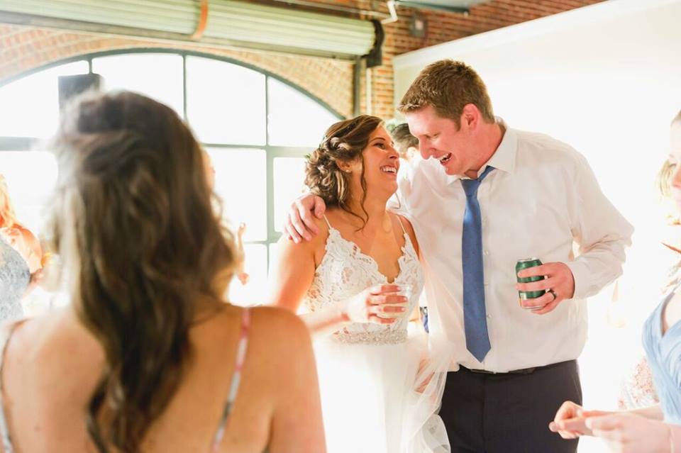 morean center a chair affair bride and groom laughing