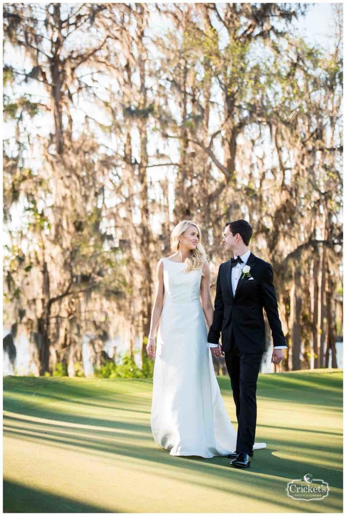 Isleworth Country Club Wedding Classic White Wedding Crickets Photo A Chair Affair Couple Hand in Hand