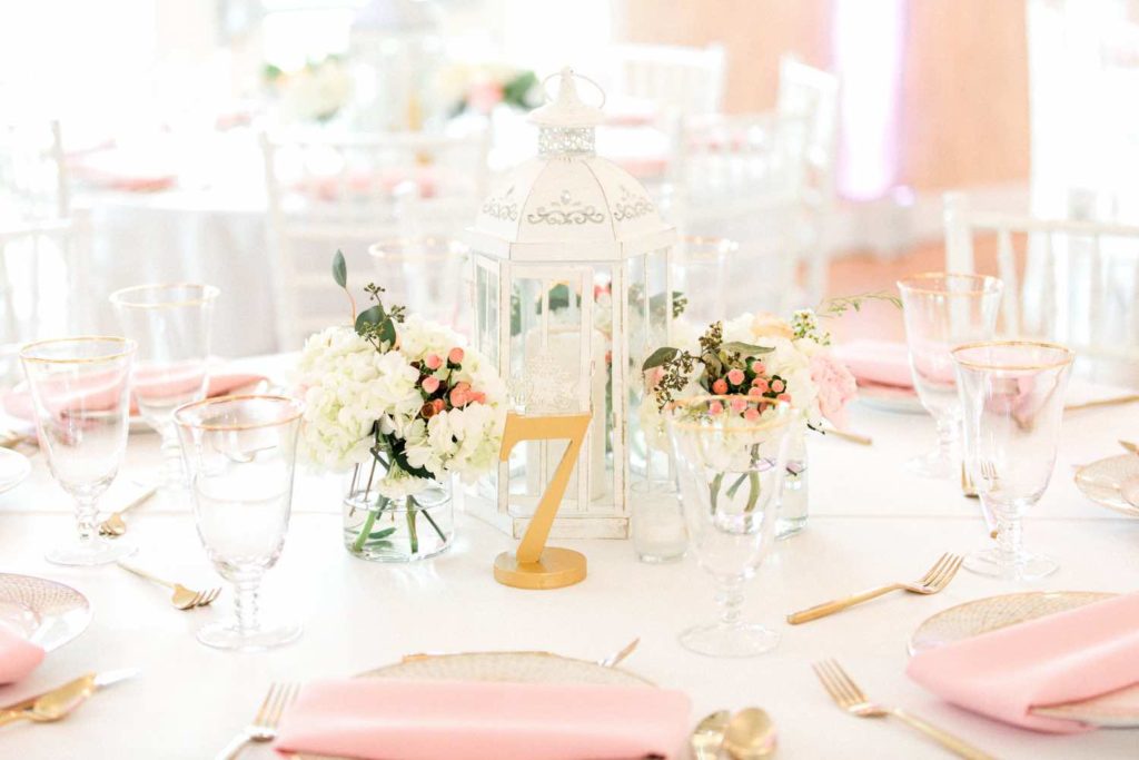 The Banyan Estate Blush and Ivory Wedding Flora Bloom Photography A Chair Affair gold brushed flatware and gold rimmed stemware