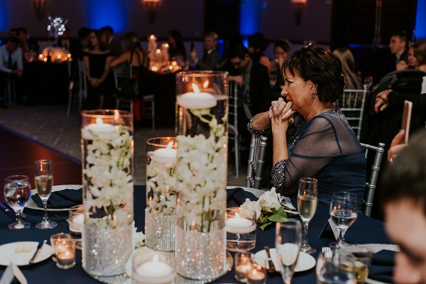 Alfond-Inn-Wedding-A-Chair-Affair-LGBT-Wedding-Silver-Glitter-Rim-Sprial-Chargers-Navy-Linens.